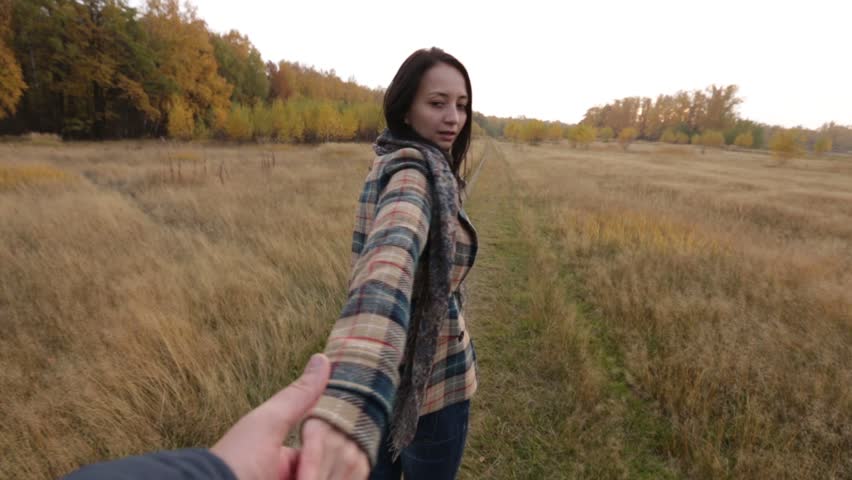 Girl leading a man to the adventure